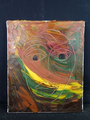une photo d'une peinture représentant un visage sur une feuille de papier