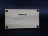 a close up of a piece of wood with a hole in it