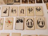 a table with a lot of cards and pictures on it