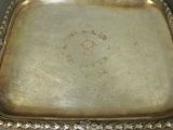 a silver tray that has a picture on it