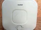 an image of a white water heater sitting on top of a wooden floor