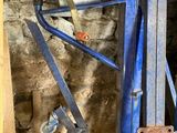 a picture of a man working on a machine in a building