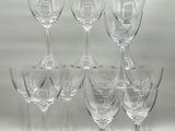 many empty wine glasses sitting on a white table
