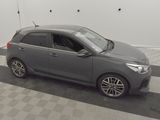 an image of a grey car parked in a garage