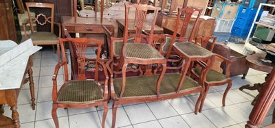 a lot of chairs and tables in a room