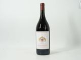 a bottle of wine that is sitting on a table