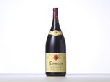 a bottle of red wine sitting on top of a table