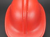 red hard hat on a black background