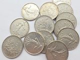 a lot of coins that are sitting on a table