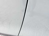 a close up of a car ' s door handle with a sticker on it