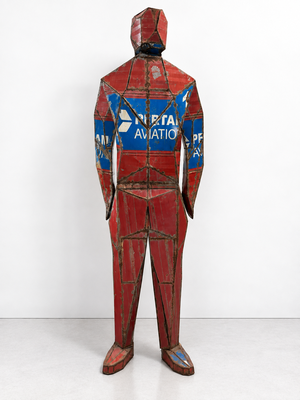 a sculpture of a man in a red and blue suit