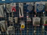 many different tools on the wall in the store