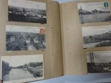 an open book with pictures of a city on it