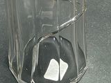 a glass container with a piece of paper inside of it