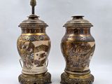 pair of antique chinese vases on stands with asian scenes on them