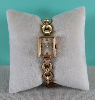 an image of a wrist watch on a pillow
