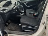 the interior of a car with the door open and the driver ' s seat up