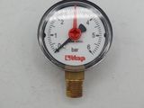 a close up of a pressure gauge on a white surface