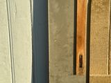 a metal object hanging on the side of a building