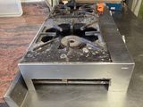 an image of a kitchen with a stove and a counter top