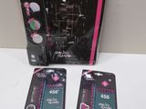 two pink and black toothbrushes and a pink and white toothbrush