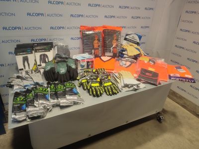 a table with a lot of tools on it in front of a wall
