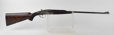 a rifle on a clear stand with a white background