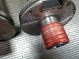 a close up of a metal object on a metal surface