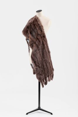 a close up of a mannequin with a fur coat on it