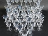 a lot of empty wine glasses sitting on a table