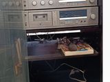 a stereo system that is sitting inside of a cabinet