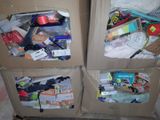 two boxes with different items in them sitting on the floor