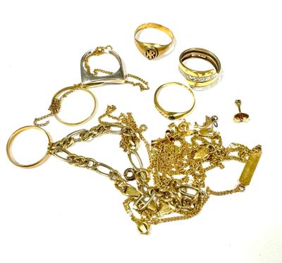 a lot of gold jewelry on a white surface