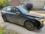 a picture of a black car parked on the side of the road