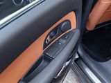 a close up of a car door with the door handle open