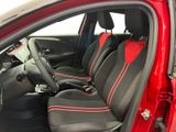 the interior of a red car with black seats and red trims