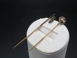 a close up of a pair of chopsticks sitting on top of a white container