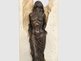 statue of a man holding a piece of wood in his right hand