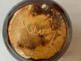 a pancake in a cup with writing on it