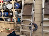 a ladder that is leaning against a wall in a garage