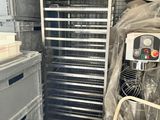 a metal rack with a lot of food in it