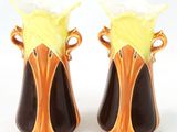 two vases that are sitting on a white surface
