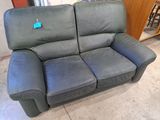 a couch that is sitting in the middle of a room