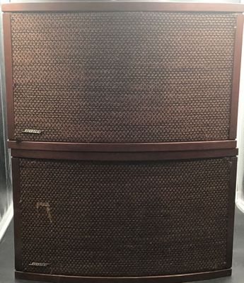 a brown cabinet with two doors and a brown handle