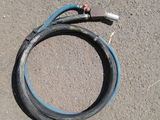 a hose that is laying on the ground next to a hose