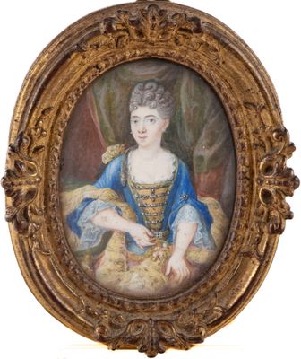 an old picture of a woman in a blue dress in a gold frame