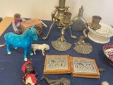 a table with a blue table cloth and various figurines on it