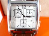 a close up of a watch with a leather strap