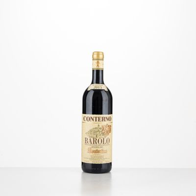a bottle of red wine sitting on top of a table
