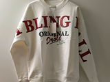 a white sweatshirt with the words being original is hanging on a hanger